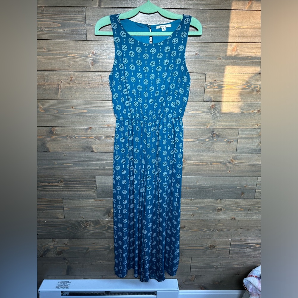 Francesca’s teal patterned flowy jumpsuit